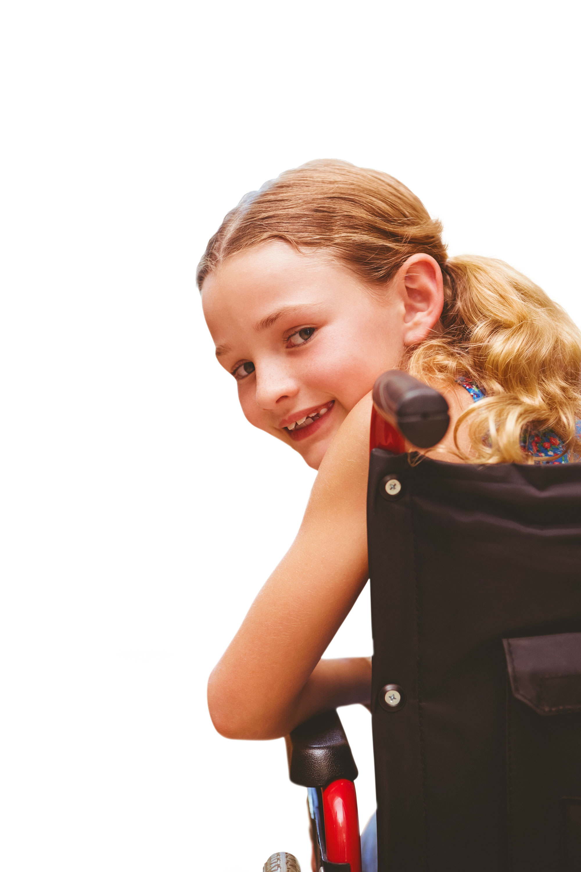 Portrait of cute girl sitting in wheelchair