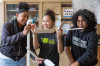 Two high school girls and one high school boy in science lab