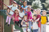 Big group of multi-ethnic children on a sunny playground